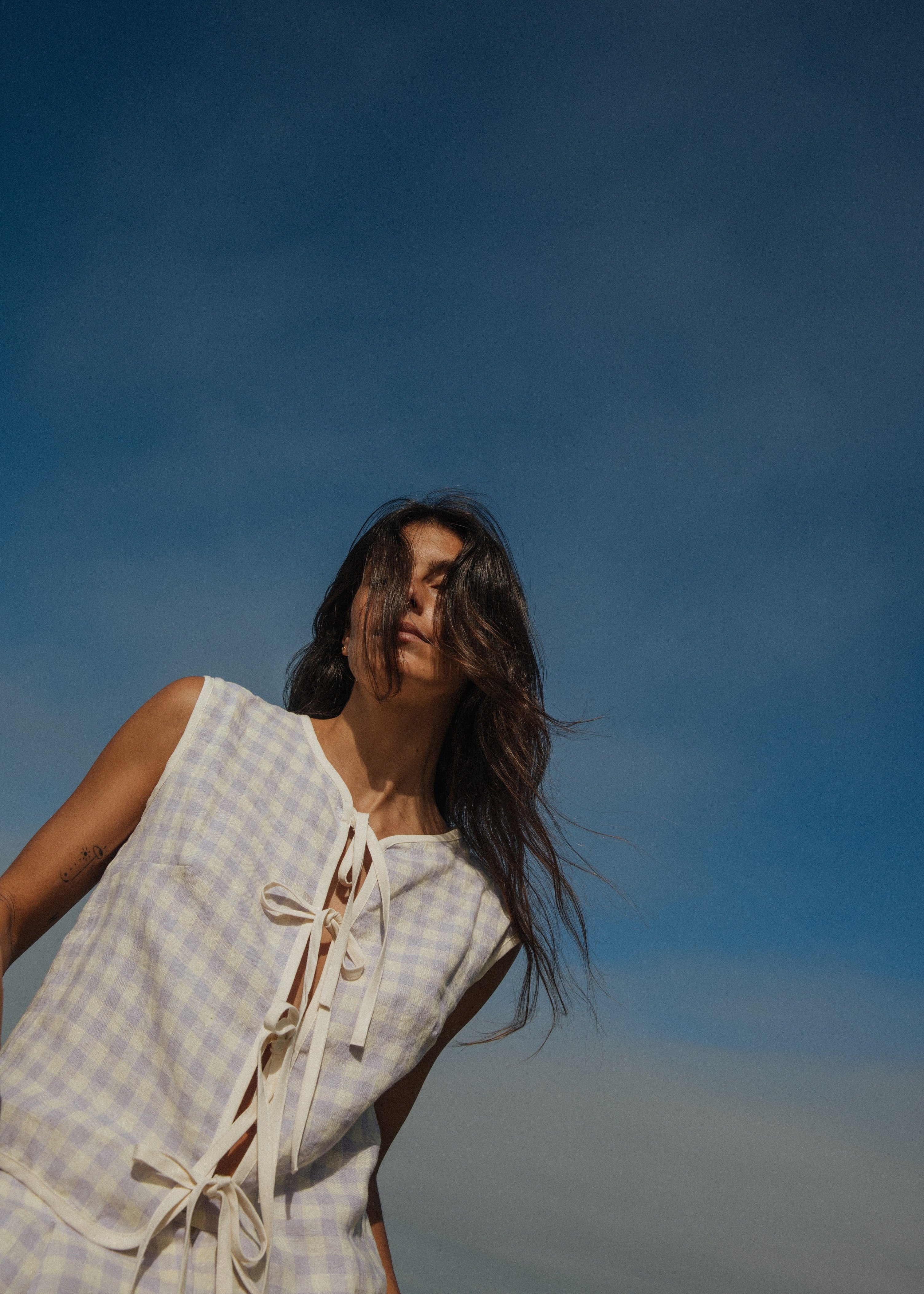 Checkered sleeveless blouse